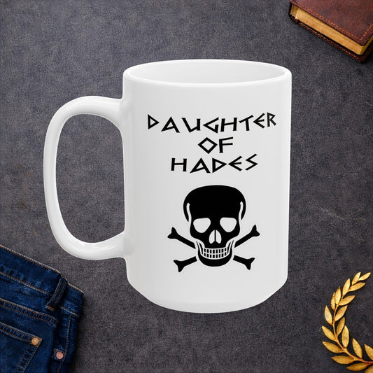 A bold, dark-themed graphic for a white ceramic mug. The design features a large, detailed outline of a skull and crossbones at the center. Above the skull, the words "DAUGHTER OF HADES" are written in a sharp, ancient Greek-inspired angular font. The entire design is rendered in a clean, high-contrast black outline style.