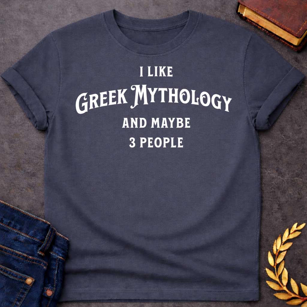 Dark Heather t-shirt with A Minimalist typography Greek mythology t-shirt design featuring bold white text that reads, "I Like Greek Mythology and Maybe 3 People." The playful layout uses a mix of vintage-inspired serif and decorative lettering with strong visual hierarchy, creating a humorous design for mythology enthusiasts with an introverted sense of humor.