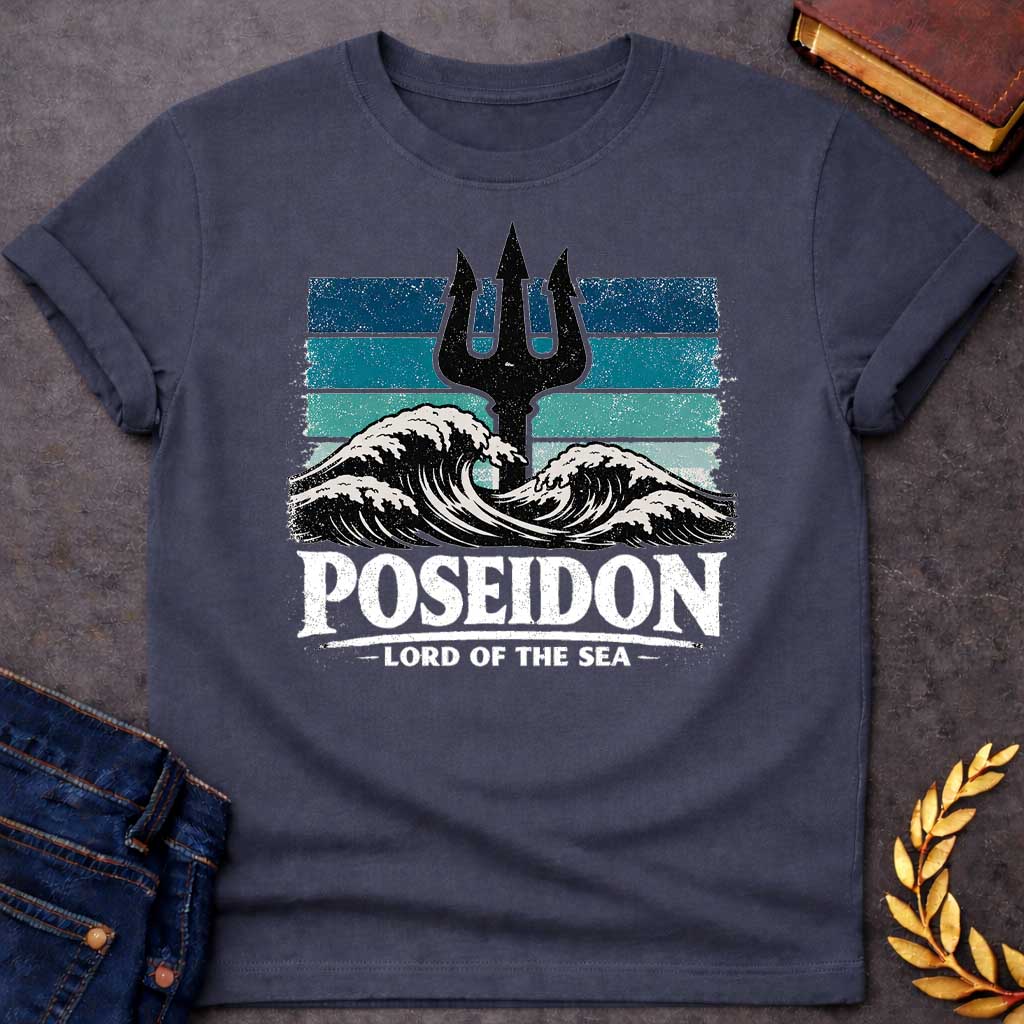 Dark Heather T-Shirt A vintage-style graphic shirt design. The central image features a distressed, black silhouette of a trident rising from the center of crashing, white-capped ocean waves. Behind the trident is a square background made of horizontal stripes in shades of blue, teal, and light seafoam, all with a heavily weathered and grainy texture. Below the waves, the name "POSEIDON" is written in large, bold, white distressed block letters. Underneath the name, the title "— LORD OF THE SEA —" is displ