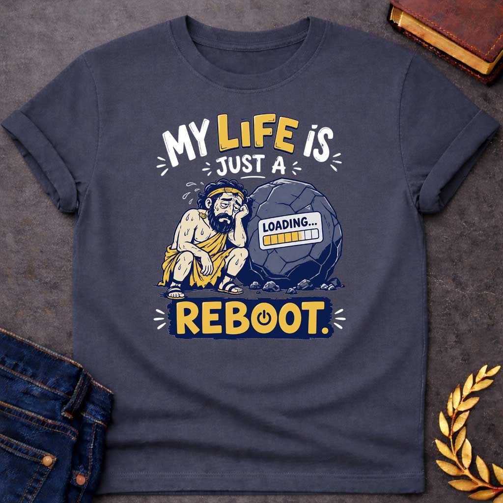 Dark Heather T-Shirt with a humorous graphic design featuring a stylized, weary-looking Sisyphus sitting next to his iconic boulder. The boulder features a digital "LOADING..." progress bar on its surface. The text above reads "MY LIFE IS JUST A" and the word "REBOOT." is featured prominently at the bottom in a bold, yellow block with a power symbol integrated into the letter 'O'. The design uses a color palette of muted blues, yellows, and grays, set against a white background.