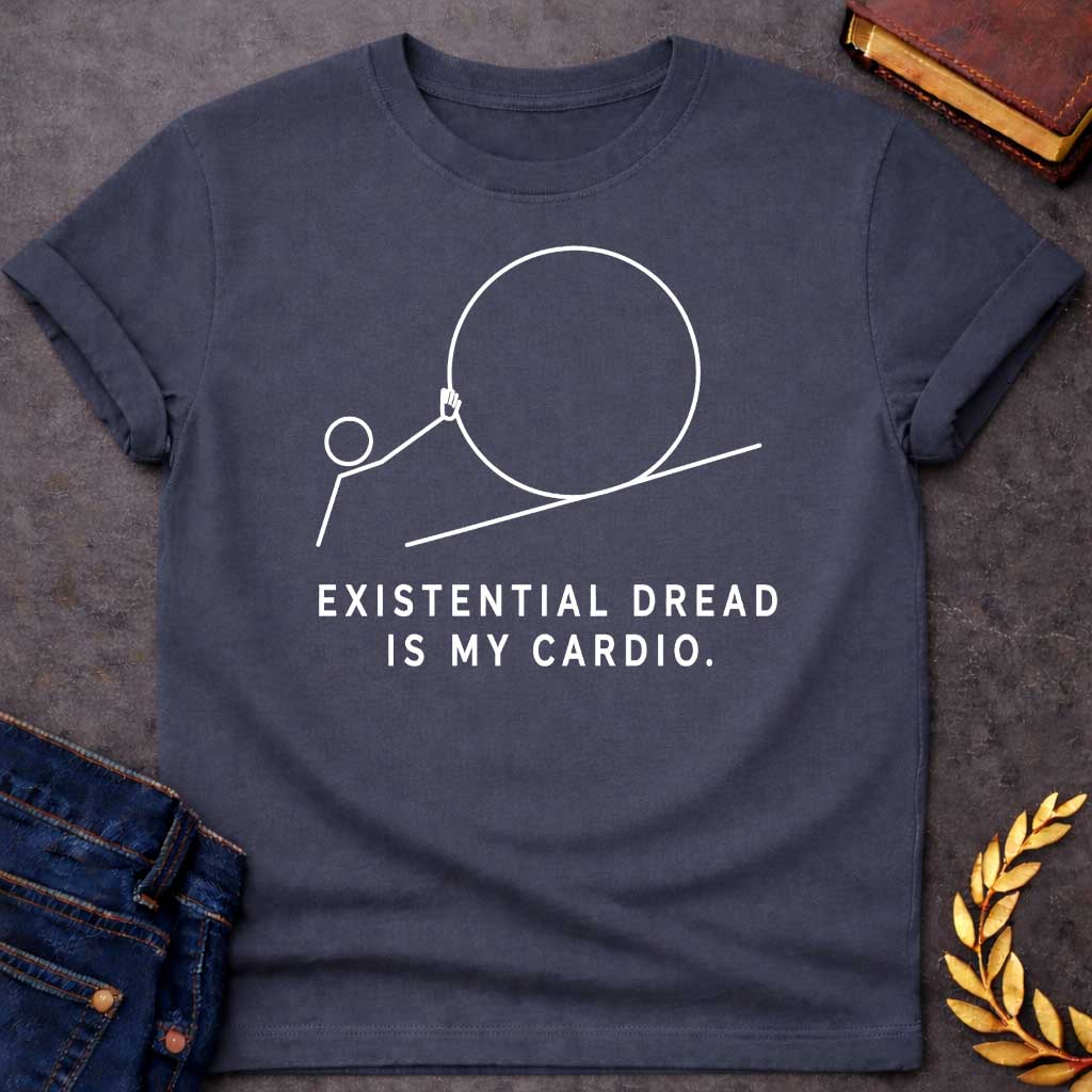 Dark Heather T-Shirt with a minimalist white graphic design. It features a simple line-art illustration of a stick figure pushing a large circle up a diagonal line, depicting a humorous take on the myth of Sisyphus. Below the illustration, the white text reads: "EXISTENTIAL DREAD IS MY CARDIO."