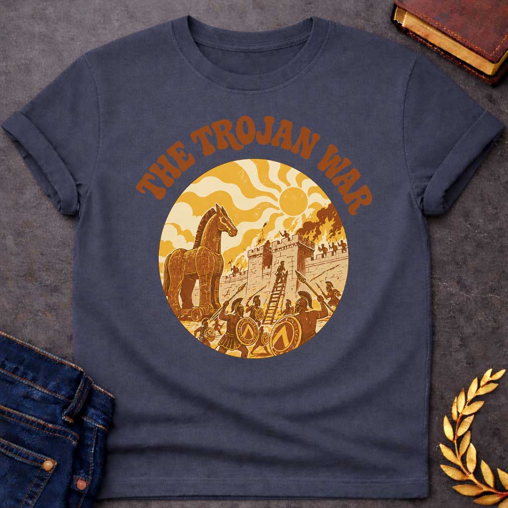 Dark Heather T-shirt featuring bold groovy 1970s-style arched brown text reading "The Trojan War" above a circular vintage illustration depicting the siege of Troy — the Trojan Horse stands to the left while Greek warriors with Spartan shields and spears storm the burning walls of Troy using a ladder, under a stylized wavy sun, rendered in a warm retro palette of golden yellow, burnt orange, and brown tones