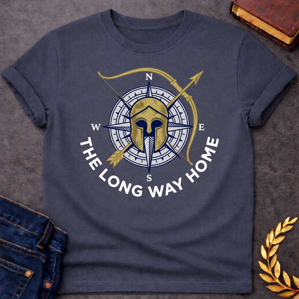 Dark Heather T-Shirt with a logo design combining Greek warrior imagery with nautical navigation elements. A weathered gold Corinthian helmet overlays a navy blue and white compass rose showing cardinal directions (N, S, E, W). A golden bow and arrow cross diagonally behind. Text reading 'THE LONG WAY HOME' curves around the bottom in navy blue. References Odysseus's epic journey in Homer's Odyssey, blending ancient Greek military symbolism with maritime wayfinding to evoke adventure, perseverance, and the