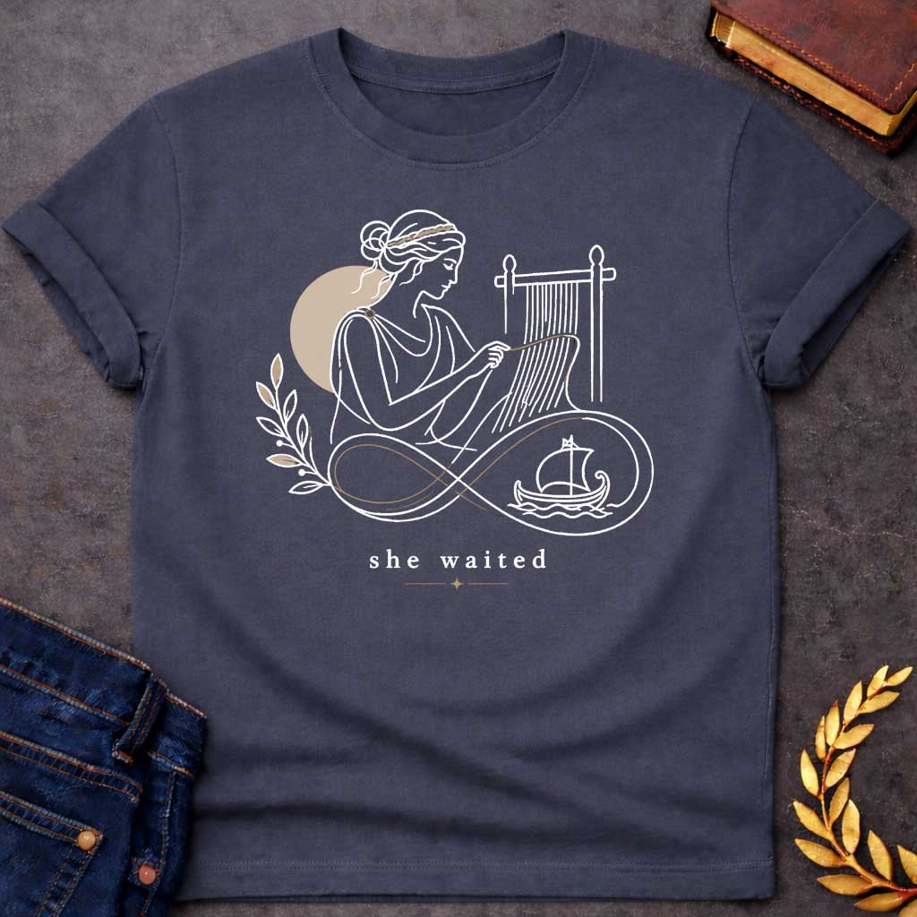 Dark Heather T-Shirt with a Minimalist line art of Penelope weaving at a loom, wearing classical Greek robes with braided hair. Rendered in elegant black linework with tan accents. An infinity symbol flows from the loom, incorporating an olive branch and Greek ship, symbolizing endless waiting for Odysseus. Text reads 'she waited' in serif font with decorative star. Gentle design honoring Penelope's faithful devotion and patience during her husband's 20-year absence.