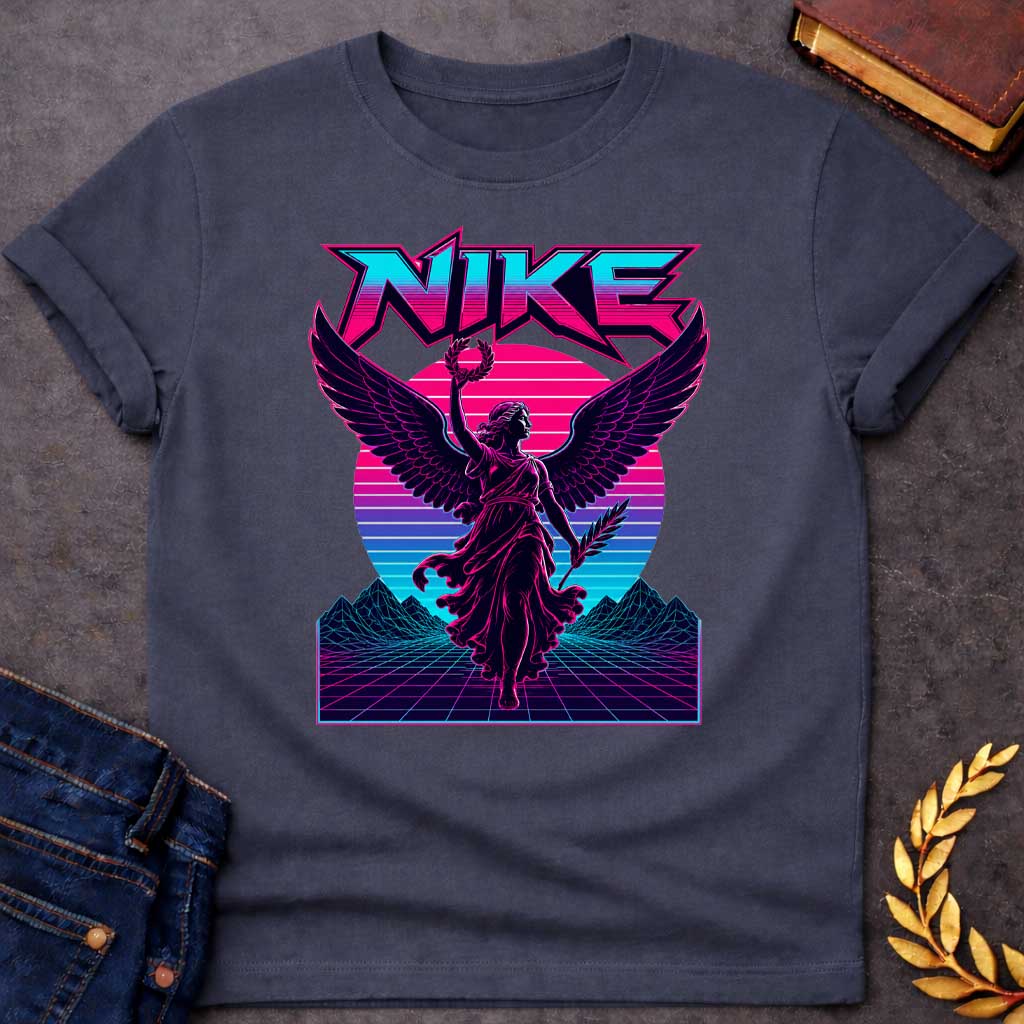 Dark Heather T-shirt with a Vaporwave-style illustration of Nike, the Greek goddess of victory, rendered in neon magenta and cyan. She wears flowing robes with large detailed wings, holding a laurel wreath and palm frond. Bold angular text 'NIKE' appears above in magenta lettering. Geometric mountains and grid landscape create a synthwave aesthetic. Horizontal gradient bands in magenta, purple, and cyan evoke 1980s digital design. Blends classical mythology with modern vaporwave art.