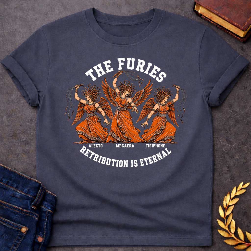 Dark Heather T-shirt with an Illustration of the three Furies, the Greek goddesses of vengeance. Three winged female figures with serpent hair wear orange draped robes with Greek key patterns. Each carries whips as instruments of punishment. Named left to right: Alecto, Megaera, and Tisiphone. Rendered in black and orange with classical details. Text reads 'THE FURIES' above and 'RETRIBUTION IS ETERNAL' below, celebrating divine justice and eternal consequences for wrongdoing.