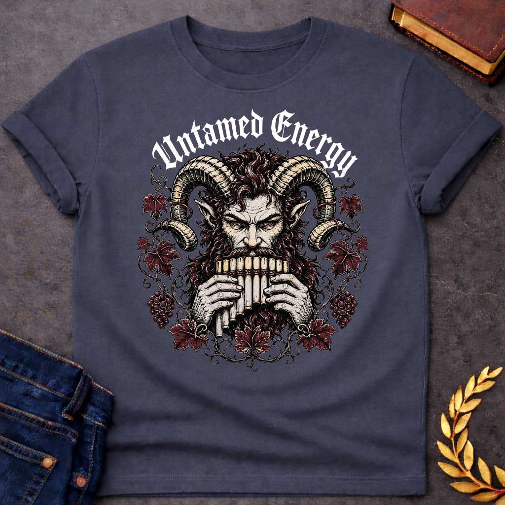 Dark Heather T-shirt with a heavy metal style t-shirt graphic. It features a powerful, intense satyr or Pan figure with large, curling ram horns playing a pan flute. His fierce face is framed by a circular wreath of detailed, twisting grapevines, deep purple-red autumn leaves, and clusters of grapes. Arched directly above the illustration, the phrase "Untamed Energy" is written in a bold, white gothic font