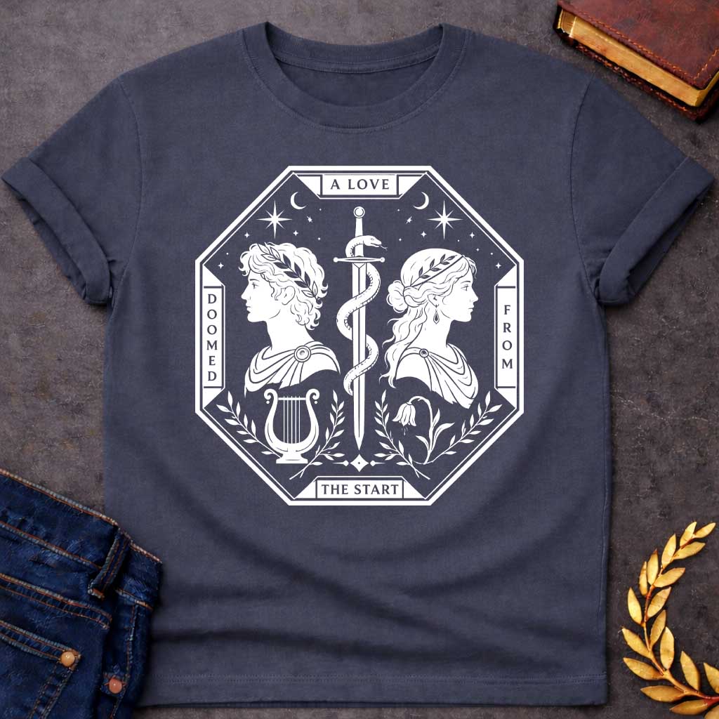 Dark Heather t-shirt in white tarot-card style: an octagonal frame shows two facing silhouette profiles (a laurel-crowned man and a woman with a headband) separated by a snake-entwined sword. Below them sit a lyre and a drooping flower, framed by olive branches, stars, and crescent moons, evoking Orpheus and Eurydice.