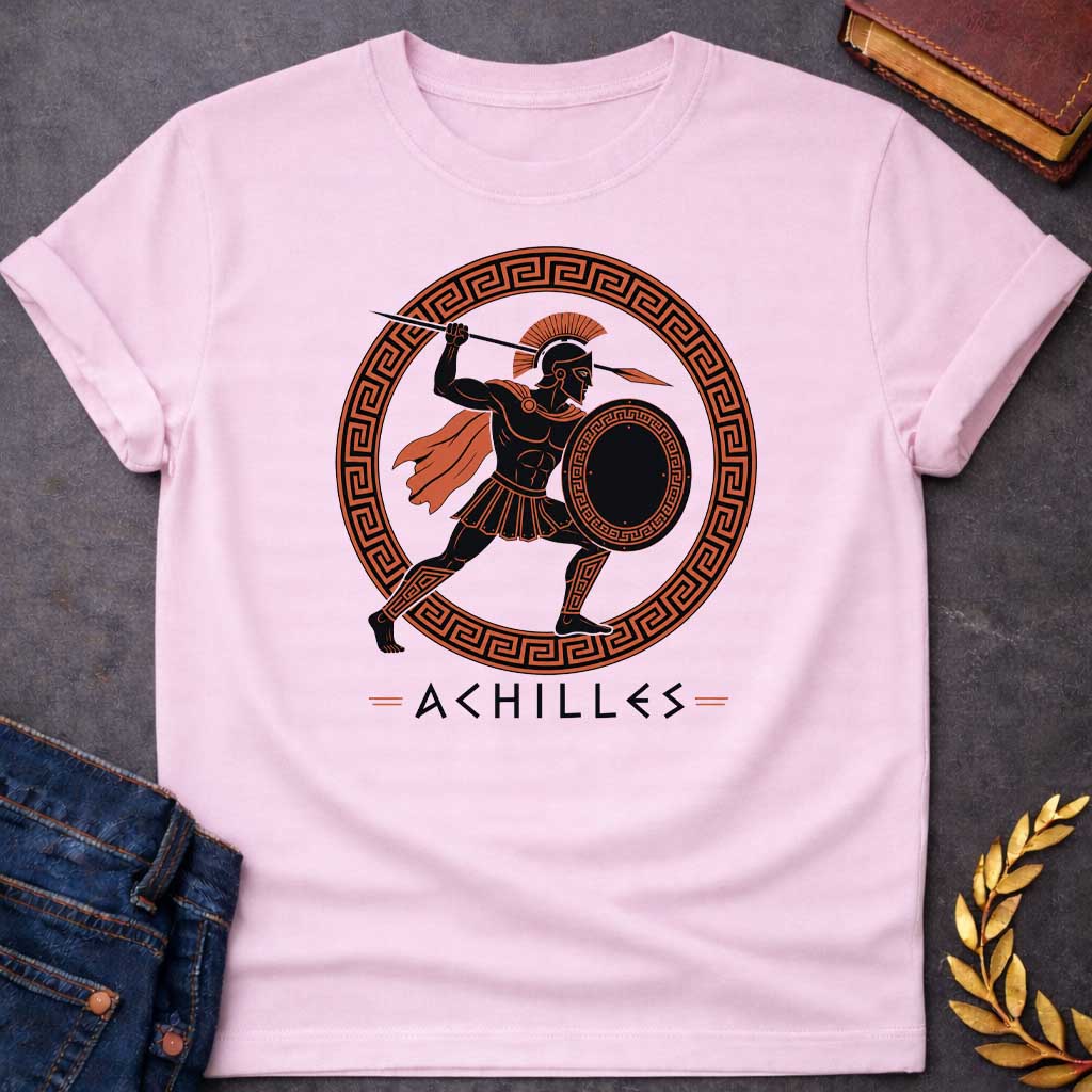 Light Pink T-Shirt with an ancient Greek red-figure pottery style illustration of Achilles in dynamic battle pose. The muscular figure is rendered in black silhouette with terracotta-orange details, wearing a crested Corinthian helmet, pleated skirt, flowing cape, and greaves. He holds a round shield with Greek key pattern and raises a spear overhead. Enclosed in a circular border with orange and black meander pattern. Below, 'ACHILLES' is written in geometric font. Evokes classical Greek pottery art.