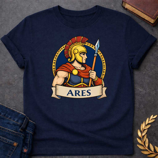 Navy T-shirt graphic featuring a vibrant illustrated portrait of Ares, the Greek God of War, shown in side profile wearing a gold Corinthian helmet with a red plume, blue and gold armor, and a flowing red cape fastened with a gold brooch, holding a spear upright. He is framed within a gold circular border against a navy background, with a scroll banner below reading "Ares," in a bold tattoo-inspired style with navy, gold, and red tones