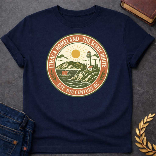 Navy T-Shirt with a Circular badge design for Ithaca Homeland - The Scenic Route, established 8th Century BC. The vintage-style emblem features a coastal Mediterranean landscape with a lighthouse, small white building with red roof, cypress trees, and rolling hills in the background. A golden sun with radiating rays shines above the scene, while stylized waves crash in the foreground. A traditional Greek ship with an orange sail floats on the water. The design uses an earthy color palette of olive green, te