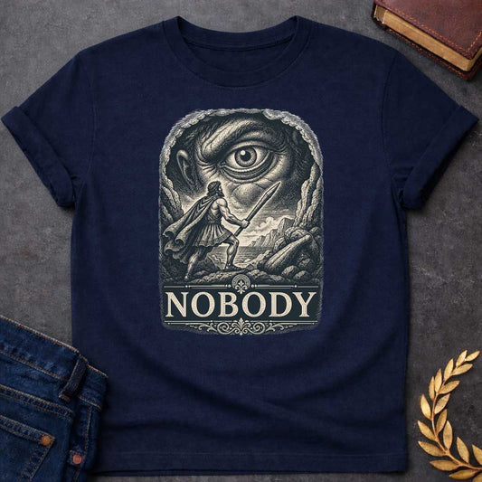 Navy T-Shirt with a Vintage engraving illustration of Odysseus confronting Polyphemus the Cyclops. A Greek warrior in armor wields a wooden stake, facing an enormous eye that dominates the composition. The scene is rendered in intricate crosshatching with cream and dark blue-black tones. At the bottom, ornate typography spells 'NOBODY' in classical serif letters, referencing Odysseus's famous trick of calling himself 'Nobody' to escape the Cyclops.