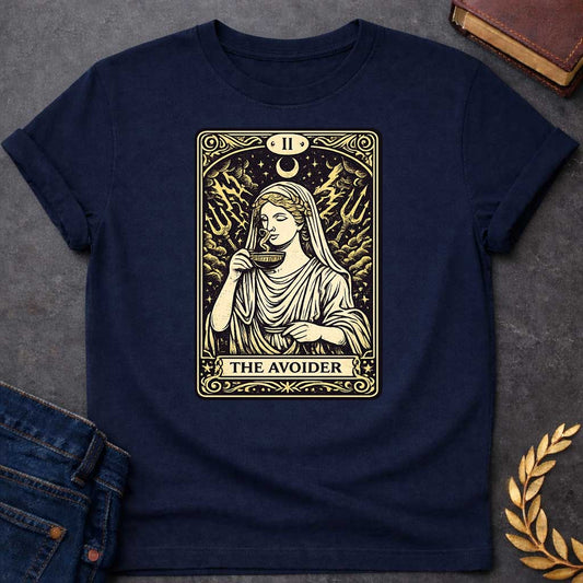 Navy T-shirt design in the style of a vintage tarot card. It features a woman in classical Greek robes calmly sipping from a cup. Behind her, lightning strikes and two tridents emerge from turbulent clouds under a crescent moon. The card is labeled with Roman numeral "II" at the top and the text "THE AVOIDER" in a banner at the bottom, all rendered in a cream and black woodcut aesthetic.