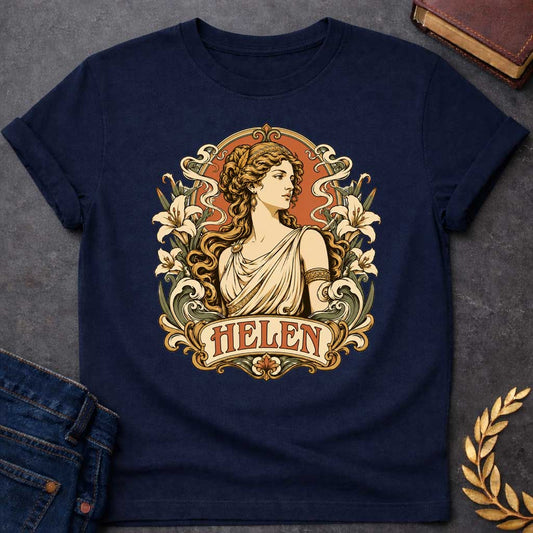 Navy T-shirt with an Art Nouveau style t-shirt graphic featuring a profile portrait of Helen of Troy. She has flowing wavy hair, a gold headband, and an elegant cream-colored Greek chiton. The design is framed by an ornate, vintage border decorated with blooming white lilies and flowing ribbons. At the bottom, an elegant banner displays the name "HELEN" in an antique font, featuring a warm terracotta and muted green color palette