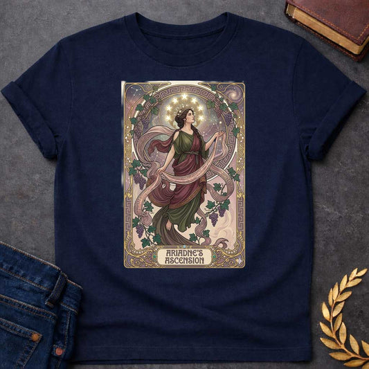Navy T-shirt with An Art Nouveau-style t-shirt graphic. Modeled like a tarot card, a graceful Greek woman floats upward, wearing a flowing green and plum gown beneath a crown of glowing stars. She is framed by an elegant, ornate golden border interwoven with purple grapevines and Greek key patterns. A decorative banner at the base displays the title "ARIADNE'S ASCENSION" in a stylized font.