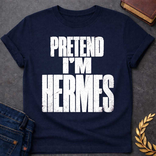 Navy t-shirt with a Pretend I’m Hermes Greek mythology design featuring bold distressed white typography on a transparent background. The stacked text reads “PRETEND I’M HERMES” in a rugged vintage block font, creating a humorous design inspired by Hermes, the Greek god of travel, messengers, trade, and trickery.