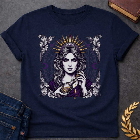 Navy T-shirt with a Mystical portrait of Medea rendered in black, purple, and gold holding an ornate potion vessel with glowing liquid dripping downward. Elaborate celestial backdrop features a radiating golden sun crown, purple moon phases, and astrological constellation patterns surrounding her face. Ornate white wing designs frame the composition. Intricate occult aesthetic celebrates the legendary Greek sorceress's magical power, ancient wisdom, and mystical enchantment.