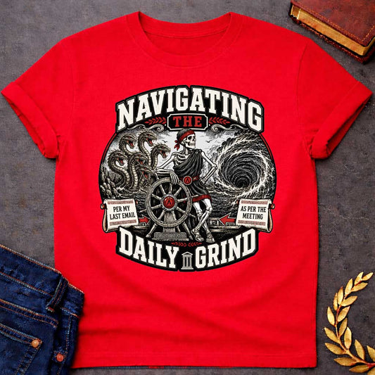 Red t-shirt with A skeleton in a toga casually leans on a ship's wheel between a multi-headed sea monster and a churning whirlpool. Bold text reads "NAVIGATING THE DAILY GRIND," with side scrolls humorously labeled "PER MY LAST EMAIL" and "AS PER THE MEETING."