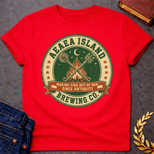 Red T-shirt with a Humorous brewery emblem of Aeaea Island Brewing Co. in green and cream vintage style. A roaring campfire with crossed torches dominates the center beneath a sun, moon, and stars. Brown banner reads 'Making Pigs Out of Men Since Antiquity' flanked by small pig silhouettes. Red stars border the circular design. Distressed texture adds authentic craft brewery aesthetic. Celebrates Circe's mythological powers of transformation and enchantment with modern craft beer culture.