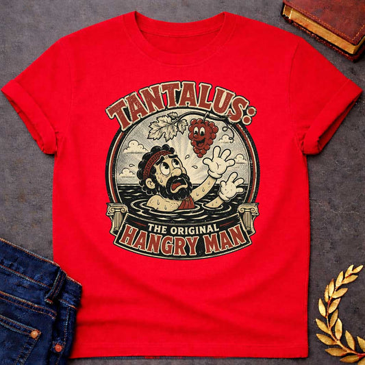 Red t-shirt with A vintage 1930s rubber-hose cartoon-style graphic. Inside a circular badge flanked by Greek columns, a distressed Tantalus stands in water reaching desperately toward a smiling cartoon grape cluster dangling above him. Arched text across the top reads "TANTALUS:" while a bottom banner features "THE ORIGINAL HANGRY MAN" in a distressed red and cream color palette.