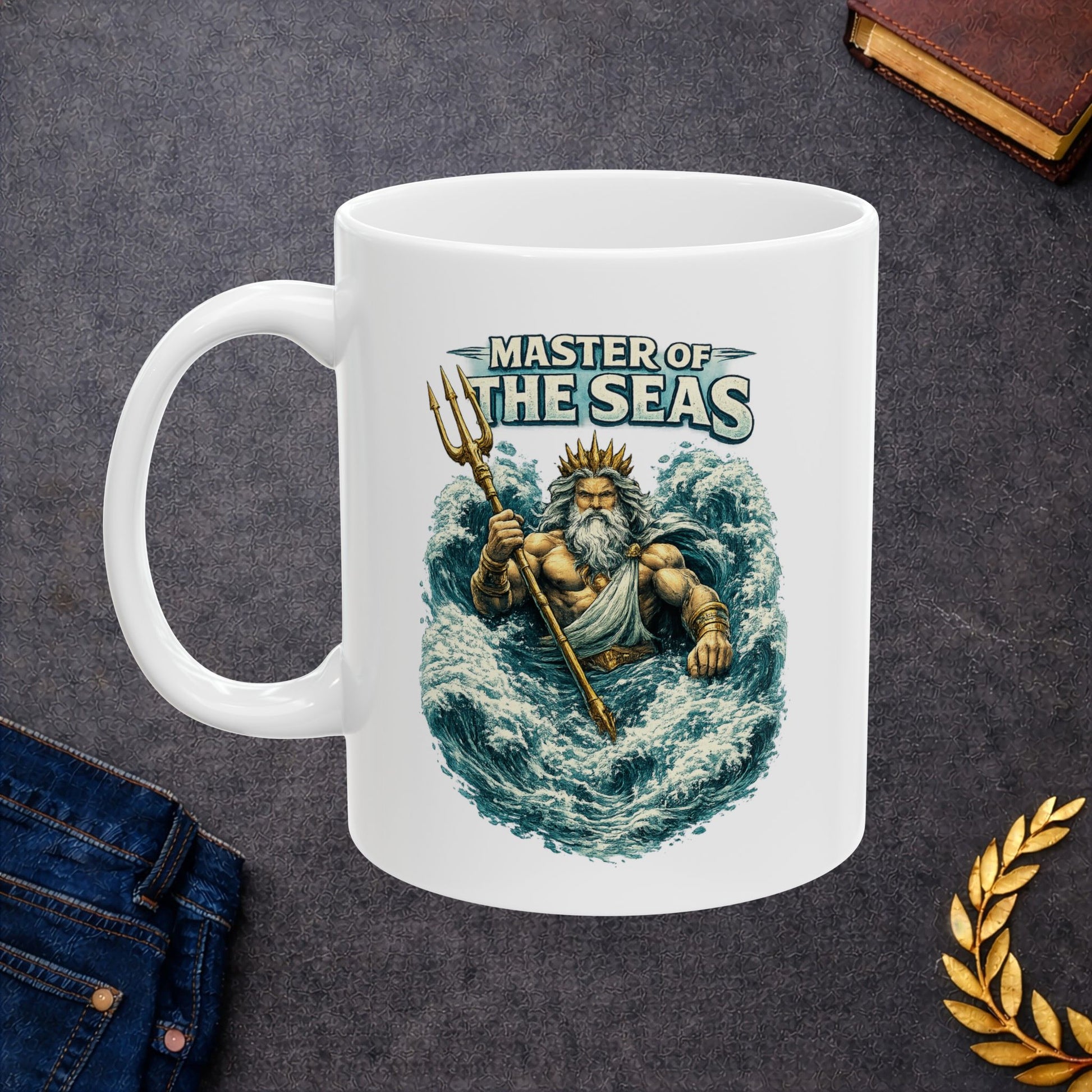 White Ceramic Mug with a  detailed, vintage-style illustration of the Greek god Poseidon rising from turbulent blue ocean waves. He is depicted as a powerful, muscular figure with a long white beard and a golden crown, gripping a gleaming golden trident. Above him, the words "MASTER OF THE SEAS" are displayed in a bold, weathered white font. The artwork features a textured, etched aesthetic against a dark background.