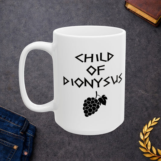 White ceramic mug featuring a minimalist, Greek-inspired graphic in black ink on a white background. The design reads 'CHILD OF DIONYSUS' in a stylized, angular font, positioned above a clean, line-art graphic of a cluster of grapes hanging from a vine with leaves.