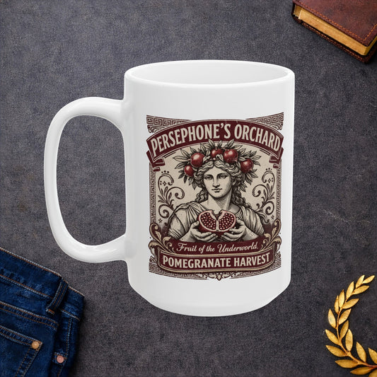 White ceramic mug with a vintage botanical-style illustration of the goddess Persephone, crowned with pomegranates and holding a halved pomegranate revealing its seeds. The artwork is framed by Greek key borders and floral scrolls in a deep burgundy hue. Banners above and below read "PERSEPHONE'S ORCHARD," "Fruit of the Underworld," and "POMEGRANATE HARVEST." The design has an elegant, aged-label aesthetic