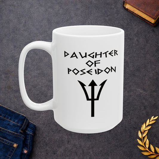A minimalist black graphic for a white ceramic mug featuring a central silhouette of a trident. Above the trident, the text "DAUGHTER OF POSEIDON" is written in a sharp, angular font reminiscent of ancient Greek epigraphy. The entire design is rendered in a clean, high-contrast black style.