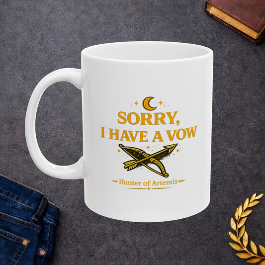 White ceramic mug with a mystical, gold-toned graphic against a dark background featuring the text "SORRY, I HAVE A VOW" in a bold serif font. A golden crescent moon and stars float above the words. Below the main text is a detailed illustration of a crossed bow and arrow surrounded by stardust sparkles, followed by the caption "Hunter of Artemis" framed by decorative gold accents.