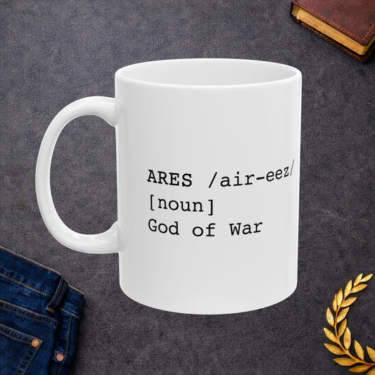 White ceramic mug featuring a dictionary-style definition graphic in black text on a white background. The text reads: 'ARES /air-eez/ [noun] God of War.