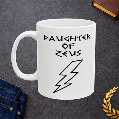 A minimalist black graphic for a white ceramic mug featuring a large, central outline of a lightning bolt. Above the bolt, the text "DAUGHTER OF ZEUS" is written in a sharp, angular font inspired by ancient Greek inscriptions. The entire design is rendered in a clean, high-contrast black outline style.
