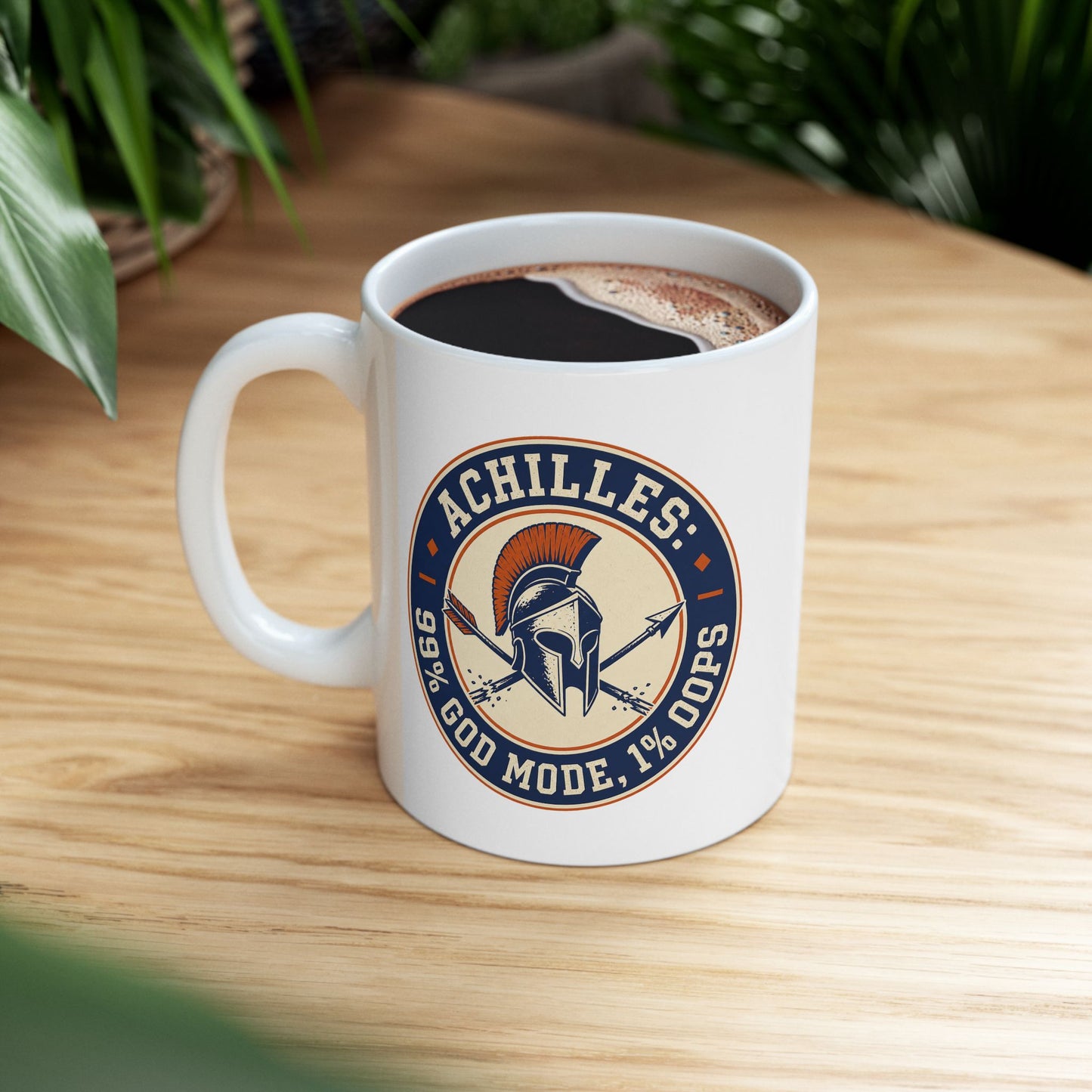 White ceramic mug with a circular, vintage-style athletic emblem dedicated to Achilles. At the center is a detailed Trojan or Greek helmet with an orange crest, positioned over a crossed spear and a broken arrow. The design uses a dark blue, cream, and orange color palette. Bold block text wrapping around the border reads "ACHILLES: 99% GOD MODE, 1% OOPS," referencing his mythological weakness.