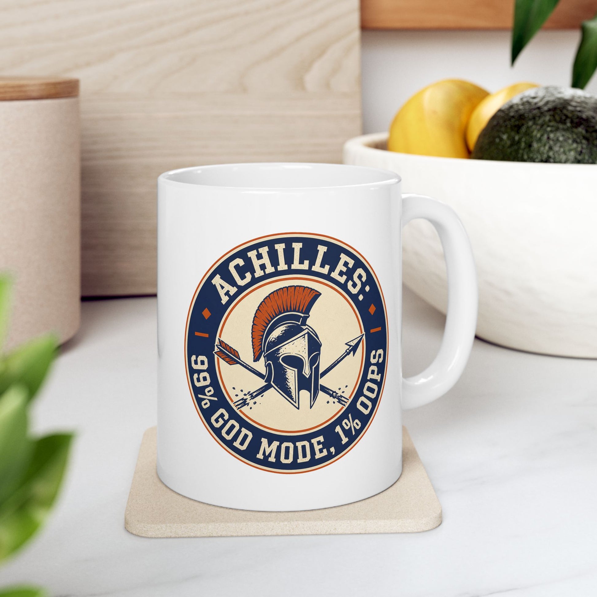 White ceramic mug with a circular, vintage-style athletic emblem dedicated to Achilles. At the center is a detailed Trojan or Greek helmet with an orange crest, positioned over a crossed spear and a broken arrow. The design uses a dark blue, cream, and orange color palette. Bold block text wrapping around the border reads "ACHILLES: 99% GOD MODE, 1% OOPS," referencing his mythological weakness.