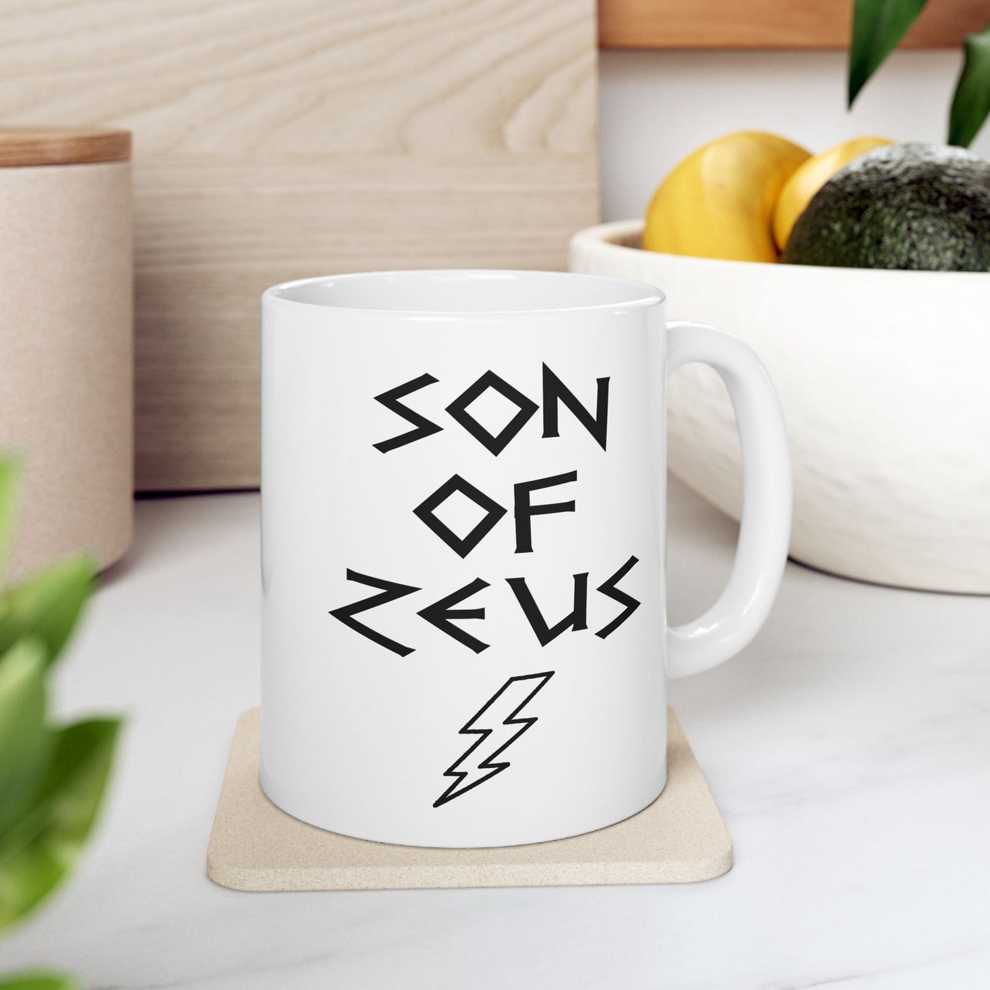 A minimalist black graphic for a white ceramic mug featuring a large, central outline of a lightning bolt. Above the bolt, the text "SON OF ZEUS" is written in a sharp, angular font inspired by ancient Greek inscriptions. The entire design is rendered in a clean, high-contrast black outline style.