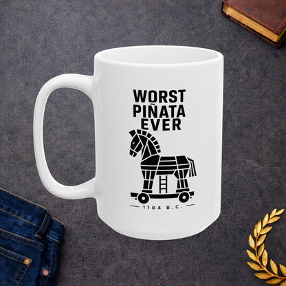 White ceramic mug with a minimalist black-and-white graphic featuring a stylized, geometric silhouette of the Trojan Horse on a wheeled platform with a small ladder underneath. Stacked above the horse, bold black text reads "WORST PIÑATA EVER." Centered below the wheels, a sub-caption reads "— 1184 B.C. —" framed by thin horizontal lines. The clean, high-contrast design offers a humorous, modern take on the ancient Greek myth.