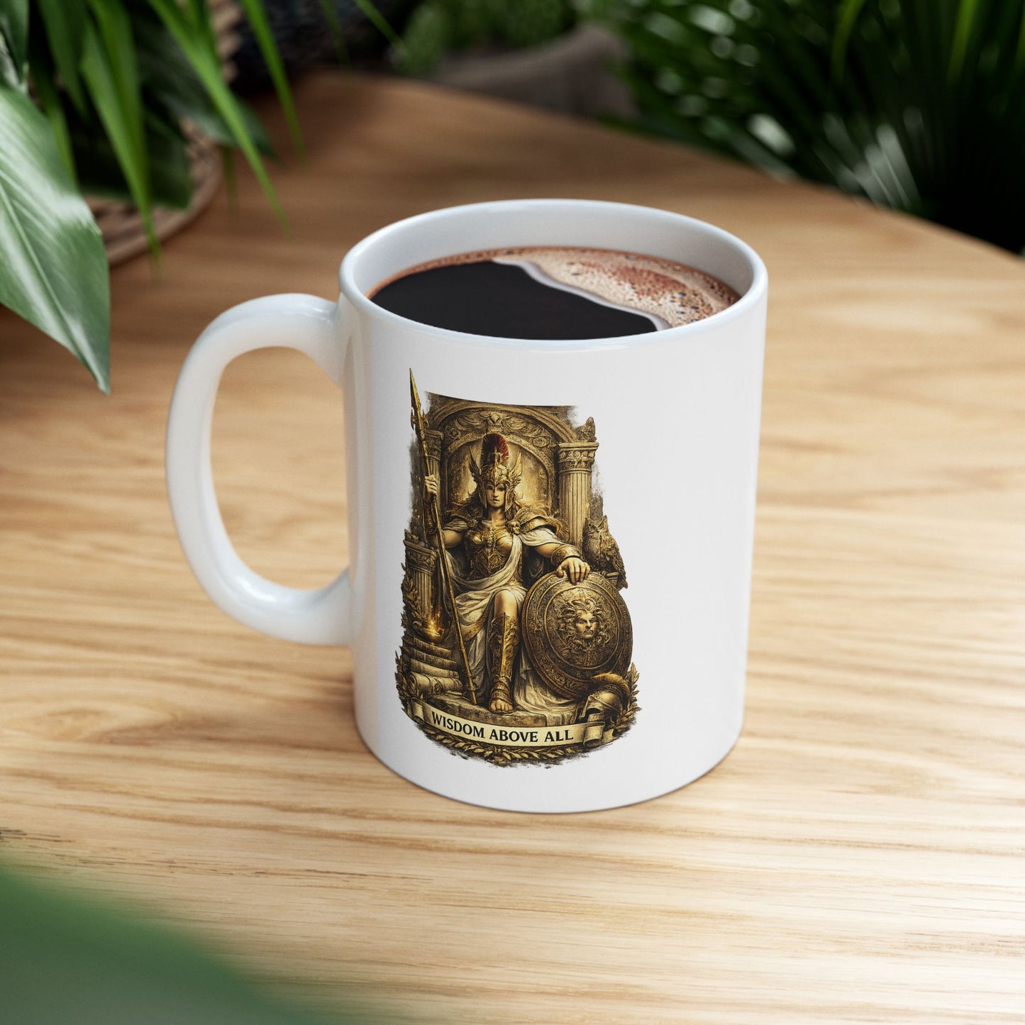 Classical engraving-style illustration of Athena, Greek goddess of wisdom, on a white ceramic mug. She wears ornate gold armor with a winged helmet and holds a spear. Her shield displays a Medusa head. She's seated within an elaborate golden temple with Corinthian columns. A torch glows at the base. Laurel wreath adorns the bottom. Text reads 'Wisdom Above All.' Golden, cream, and earth-tone palette celebrates the divine patron of wisdom, strategy, and warfare in ancient mythology.