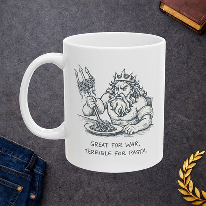 White ceramic mug with a humorous black-and-white sketch of a frustrated Greek god Poseidon attempting to eat spaghetti with his large trident. Strands of pasta are tangled awkwardly around the tines of the weapon. Below the illustration, the caption reads "GREAT FOR WAR, TERRIBLE FOR PASTA" in a distressed, handwritten-style font. The design features a clean, comic-style aesthetic.