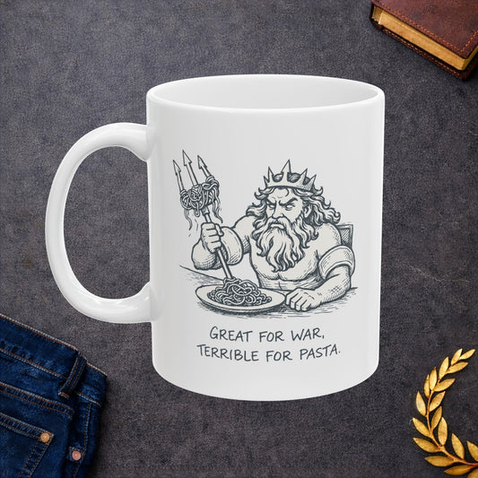 White ceramic mug with a humorous black-and-white sketch of a frustrated Greek god Poseidon attempting to eat spaghetti with his large trident. Strands of pasta are tangled awkwardly around the tines of the weapon. Below the illustration, the caption reads "GREAT FOR WAR, TERRIBLE FOR PASTA" in a distressed, handwritten-style font. The design features a clean, comic-style aesthetic.