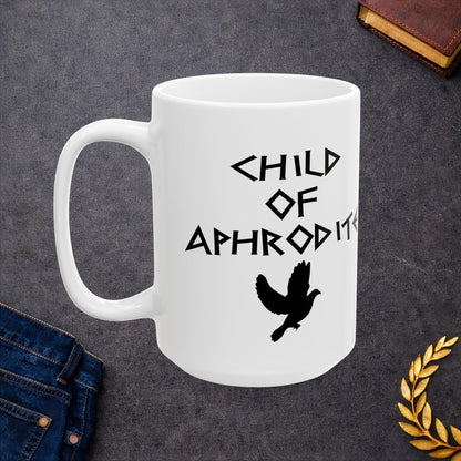 White ceramic mug featuring a minimalist, Greek-inspired graphic in black ink on a white background. The design reads 'CHILD OF APHRODITE' in a stylized, angular font, positioned above a clean, line-art graphic of a dove in flight.