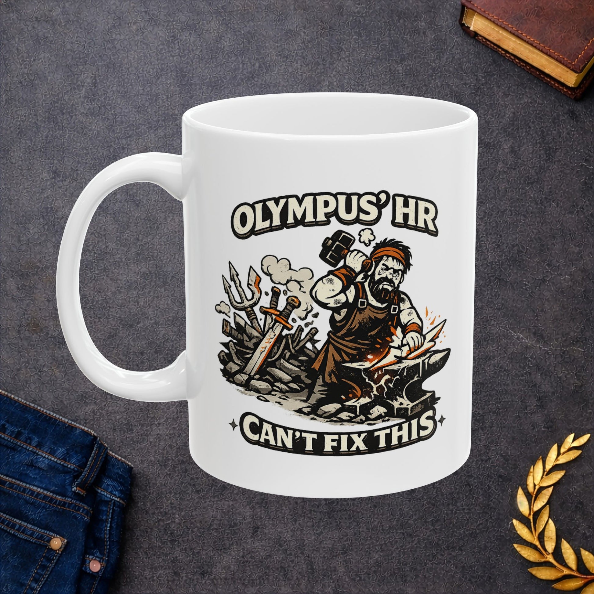 White ceramic mug with a humorous, gritty black-and-orange illustration of the Greek god Hephaestus working furiously at his anvil. He raises a heavy blacksmith hammer to forge a jagged bolt of lightning amidst flying sparks. A chaotic pile of broken swords and tridents rests behind him. Arching text above and below the scene reads "OLYMPUS' HR CAN'T FIX THIS" in a bold, rugged cream font.