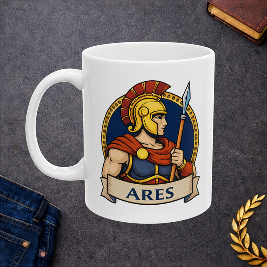 White ceramic mug with a circular emblem of the Greek god Ares in a modern vector art style. He is depicted in profile, wearing a golden Spartan-style helmet with a red crest and a red cape over blue armor. He holds a tall spear against a dark blue background bordered by a gold dotted ring. A tan parchment banner at the bottom displays the name "ARES" in bold, dark blue capital letters.