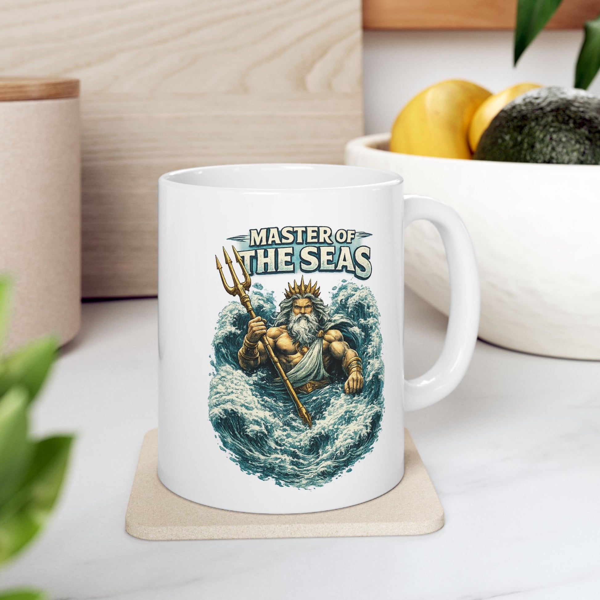 White Ceramic Mug with a  detailed, vintage-style illustration of the Greek god Poseidon rising from turbulent blue ocean waves. He is depicted as a powerful, muscular figure with a long white beard and a golden crown, gripping a gleaming golden trident. Above him, the words "MASTER OF THE SEAS" are displayed in a bold, weathered white font. The artwork features a textured, etched aesthetic against a dark background.