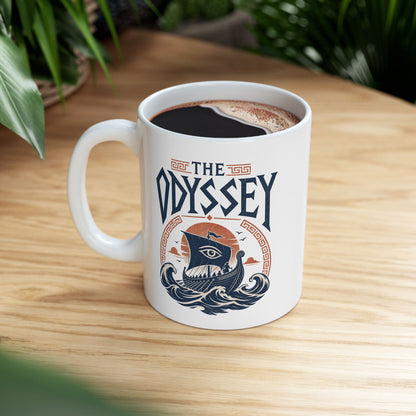 White ceramic mug with a Vintage Greek mythology white ceramic mug design inspired by The Odyssey, featuring Odysseus and his crew sailing an ancient Greek ship through powerful blue waves beneath a terracotta sunset. A watchful eye decorates the sail, framed by Greek key motifs and bold distressed "The Odyssey" lettering.