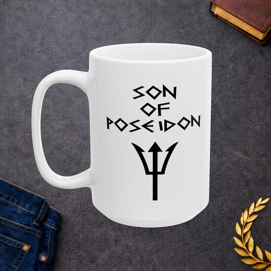 A minimalist black graphic for a white ceramic mug featuring a central silhouette of a trident. Above the trident, the text "SON OF POSEIDON" is written in a sharp, angular font reminiscent of ancient Greek epigraphy. The entire design is rendered in a clean, high-contrast black style.