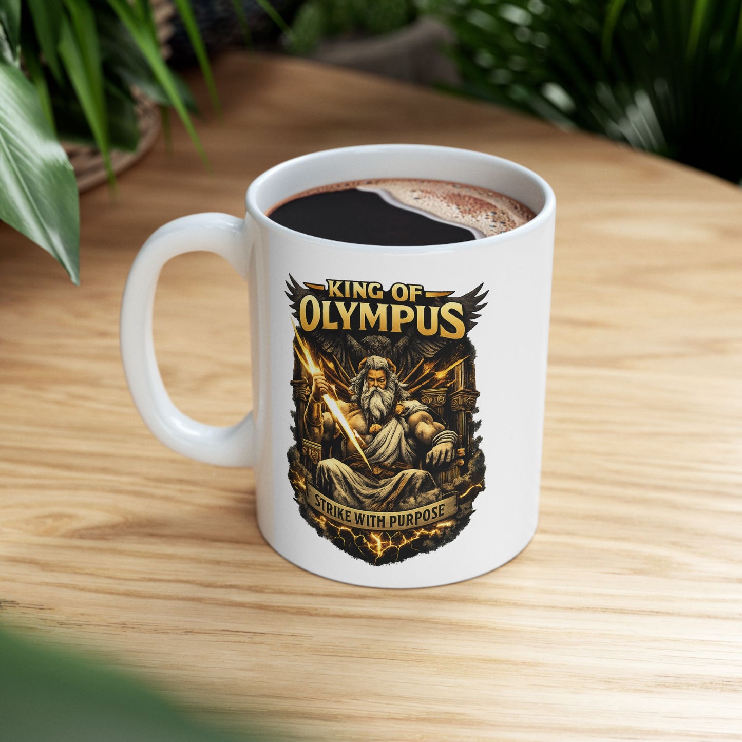 White ceramic mug with a powerful, high-contrast illustration of Zeus seated on a golden throne, holding a brilliantly glowing lightning bolt. He is depicted with a long white beard, stern expression, and muscular build, with a large dark eagle behind him. The bold golden text "KING OF OLYMPUS" arches at the top, and a weathered scroll at the bottom displays the inspiring slogan "STRIKE WITH PURPOSE."