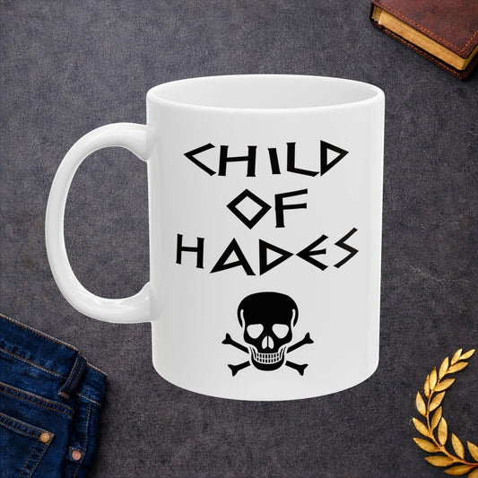 A bold, dark-themed graphic for a white ceramic mug. The design features a large, detailed outline of a skull and crossbones at the center. Above the skull, the words "CHILD OF HADES" are written in a sharp, ancient Greek-inspired angular font. The entire design is rendered in a clean, high-contrast black outline style.