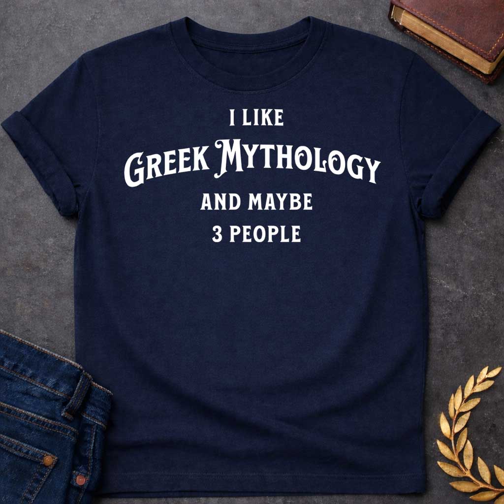 Navy t-shirt with A Minimalist typography Greek mythology t-shirt design featuring bold white text that reads, "I Like Greek Mythology and Maybe 3 People." The playful layout uses a mix of vintage-inspired serif and decorative lettering with strong visual hierarchy, creating a humorous design for mythology enthusiasts with an introverted sense of humor.