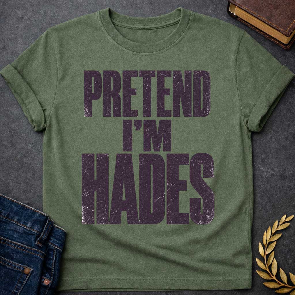 Military Green t-shirt with a Pretend I’m Hades Greek mythology design featuring bold distressed dark purple typography on a transparent background. The stacked text reads “PRETEND I’M HADES” in a rugged vintage block font, creating a humorous design inspired by Hades, the Greek god of the underworld, the dead, and riches.
