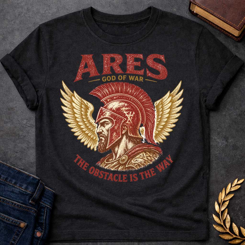 Black t-shirt with a Vintage Greek mythology design featuring Ares, god of war, wearing a battle-worn Greek helmet and armor. Golden wings frame the warrior in a bold red, gold, and cream engraving style. Text reads "Ares – God of War" and "The Obstacle Is the Way," creating a powerful design inspired by strength, courage, and ancient Greek mythology.