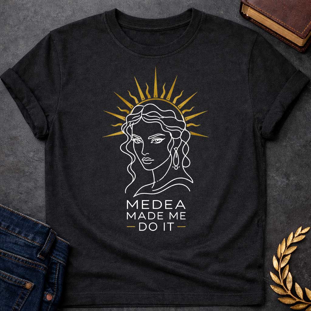 Black T-shirt with a Minimalist line art portrait of Medea with wavy hair and drop earrings, framed by a golden radiating sun halo. Black and white design with gold accents. Text reads 'Medea Made Me Do It.' Humorous reference to blaming the legendary Greek sorceress for chaotic or destructive actions. Celebrates Medea's infamous power and magical influence with tongue-in-cheek blame attribution.